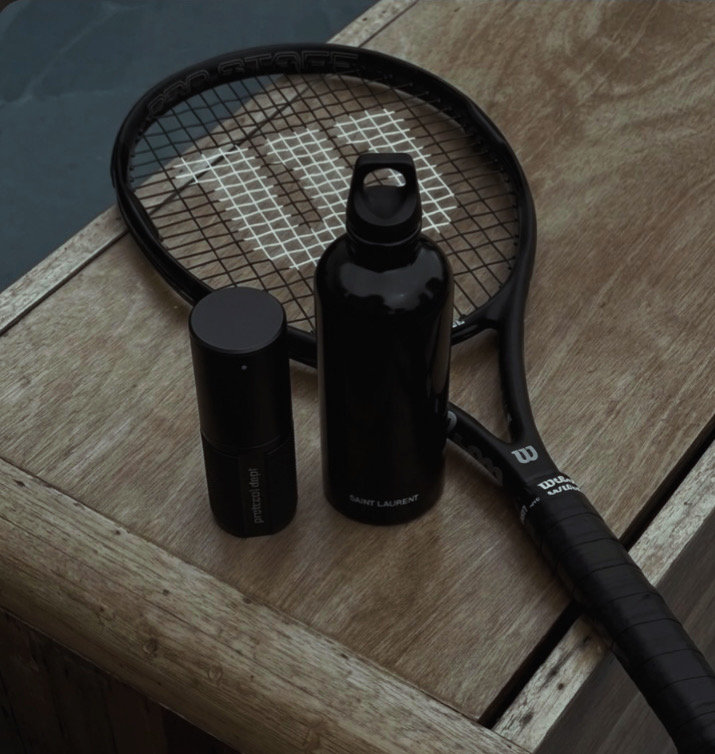 The Instrument alongside a tennis racket and Saint Laurent water bottle